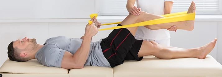 Chiropractic Mesa AZ Man Using Resistance Band Rehabilitation